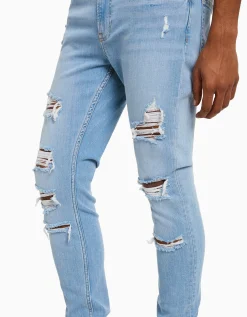 BERSHKA Jeans super skinny rotos Azul Discount