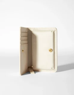 BERSHKA Monedero liso Crudo Outlet