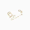BERSHKA Set 8 pendientes aros ear cuff pedrería cruz Oro Outlet
