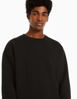 BERSHKA Sudadera cuello redondo oversize Negro Hot